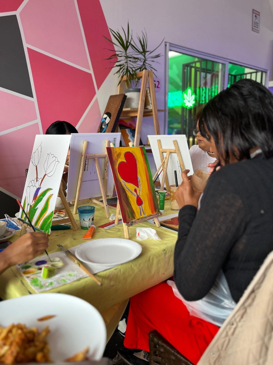 Guests painting canvases at Life Is Good Café