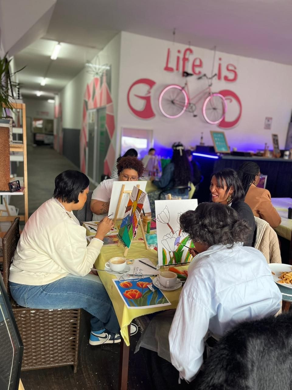 Guests painting together at Life Is Good Café